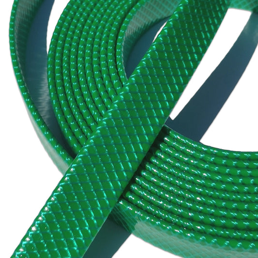 A close-up of a bright green textured plastic strap or band coiled in loops against a white background.